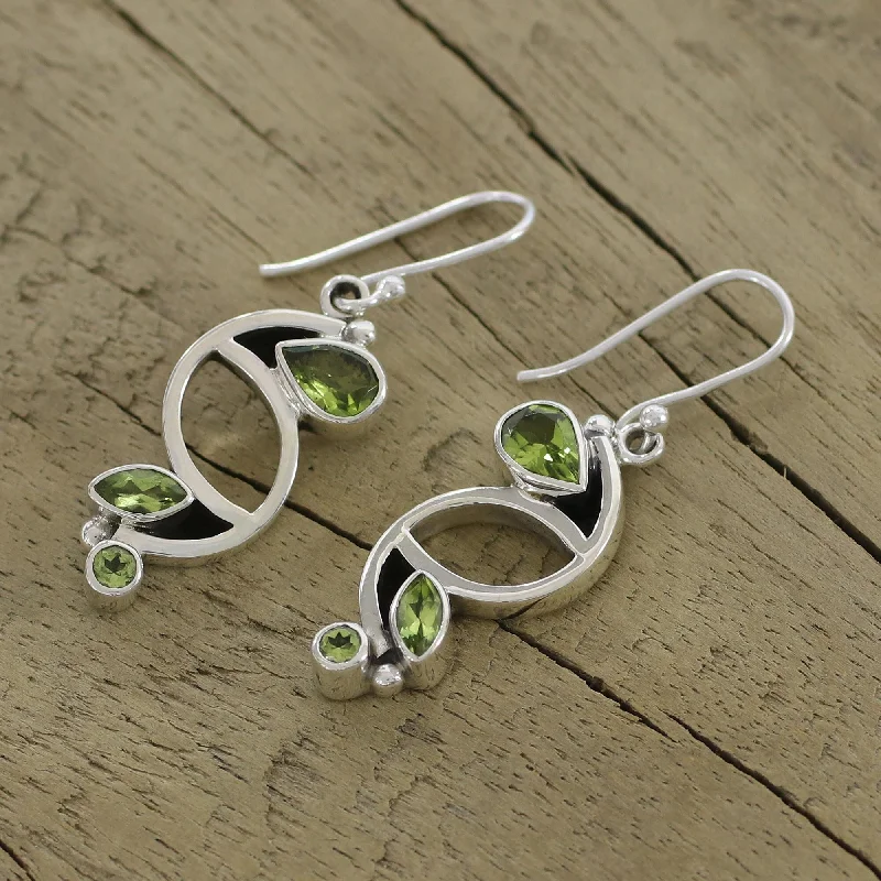 Sun flare earrings-Handmade Sterling Silver Intricate Harmony Peridot Dangle Earrings (India)